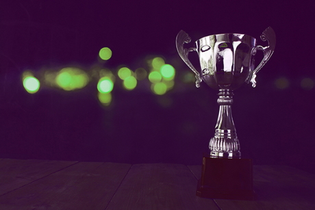 a trophy with green light spots